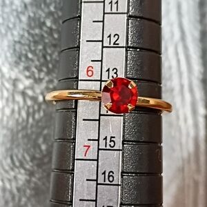 Gold Ring with Red Gemstone